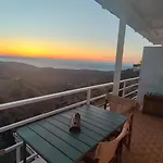 Enjoy A Wondeful Sunset From A Traditional House-Aggelos
