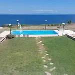 Blue Pastel-Cliffside Villa, Shared Pool, Wild Sandy Beach Nearby
