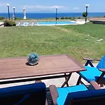 Blue Pastel-Cliffside Villa, Shared Pool, Wild Sandy Beach Nearby