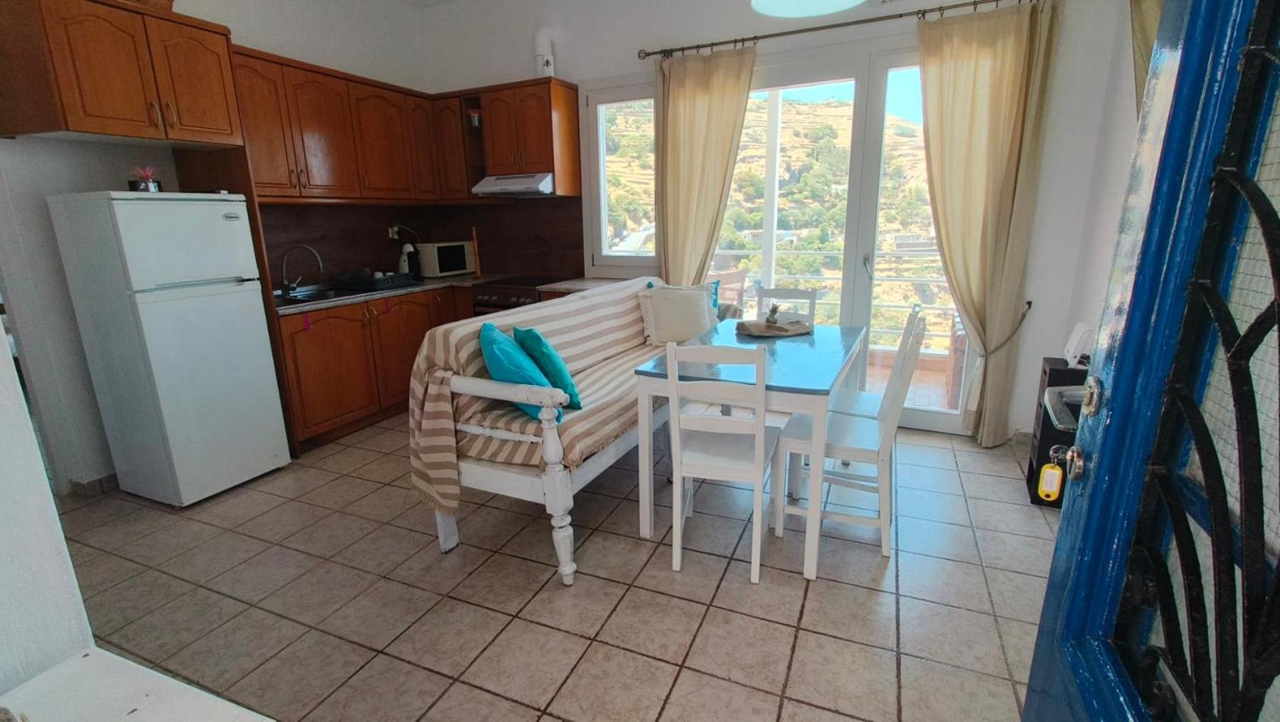 Enjoy A Wondeful Sunset From A Traditional House-aggelos Ioulis