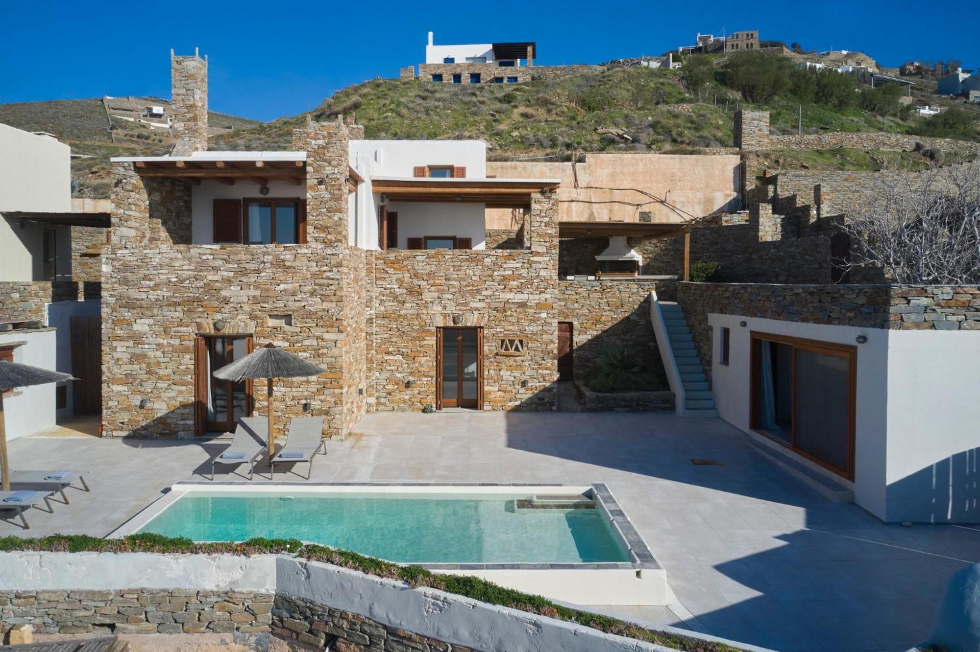 Stone With A Sea Water Swimming Pool And A Sea And Sunset View